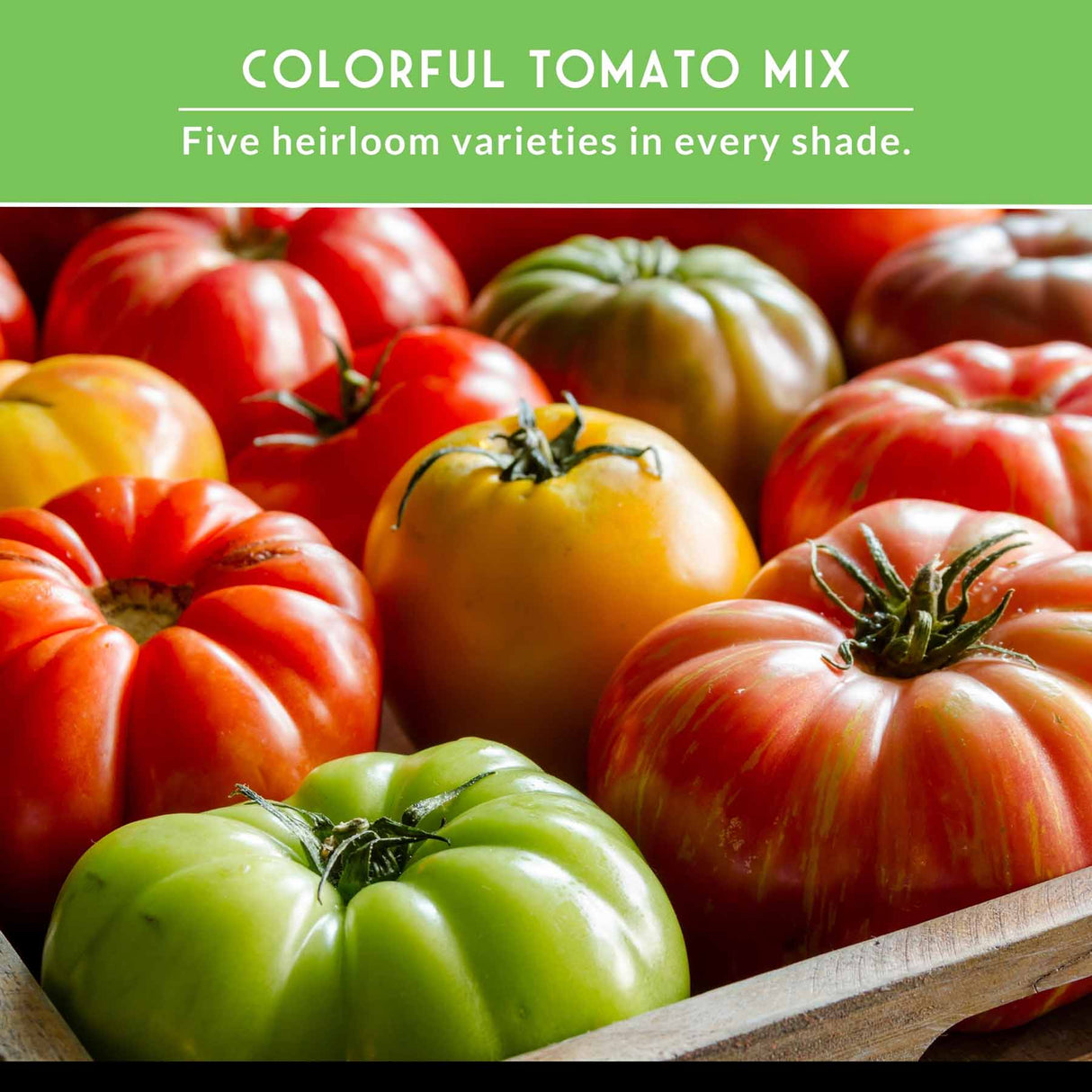 Assorted colorful tomatoes in a wooden box with a green banner above.