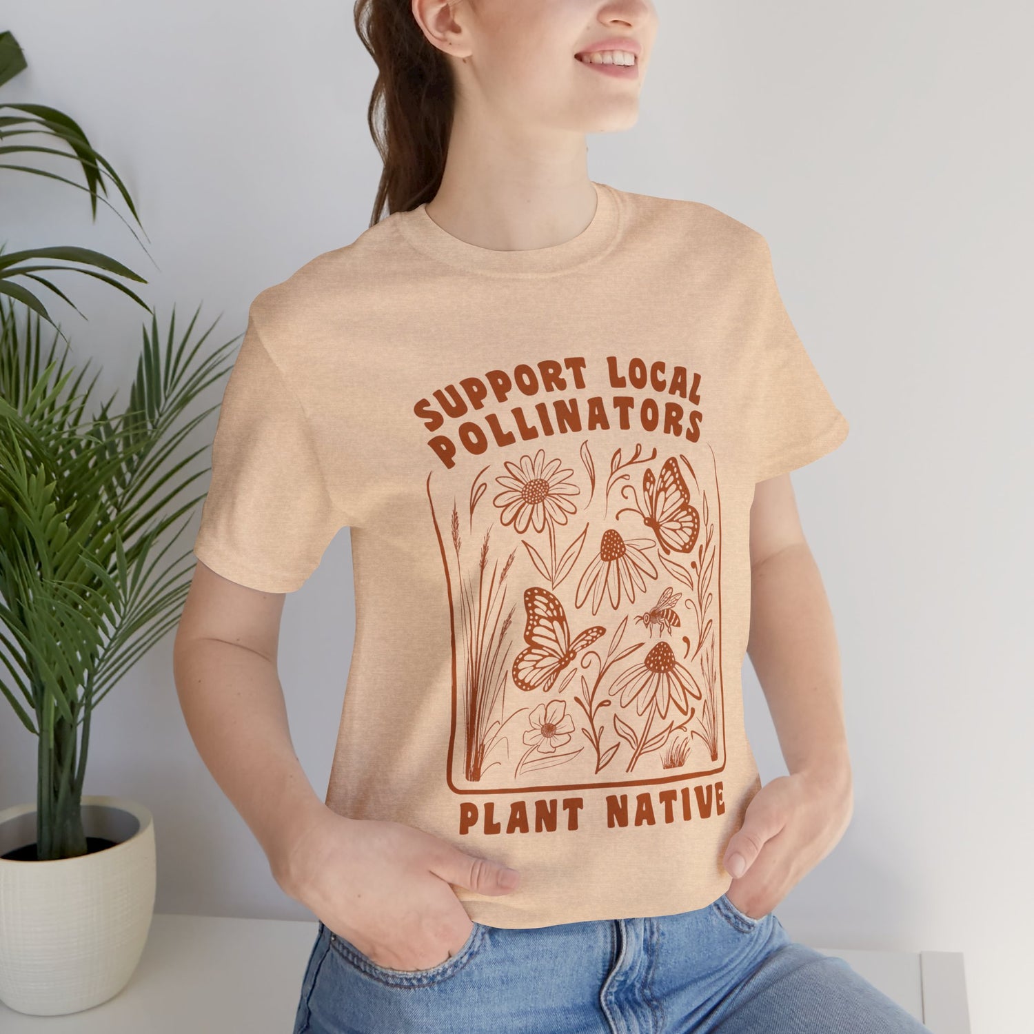 Support Local Pollinators Unisex Tee Shirt on female model - Heather Sand Dune