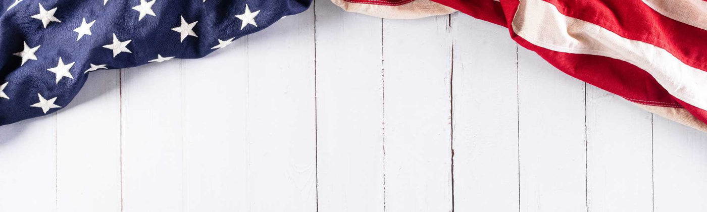 American flag draped over a white wooden surface Labor Day Sale