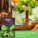 Two glasses of basil-infused drinks with a box of Survival Garden Seeds basil on a wooden surface. Fragrant and Flavorful.