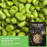 Green lima beans filling the frame, with a seed packet labeled 'Lima Bean Fordhook' and text reading 'Award-Winning Heirloom' on a green banner at the bottom.