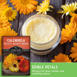 Jar of cream with calendula packaging and flowers on a wooden surface
