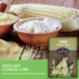 A seed packet for 'Corn Hickory King' by Survival Garden Seeds is shown in the lower right corner, set against a background of raw corn kernels, corn flour in wooden bowls, and a green text banner that reads 'EXCELLENT STORAGE CORN'.