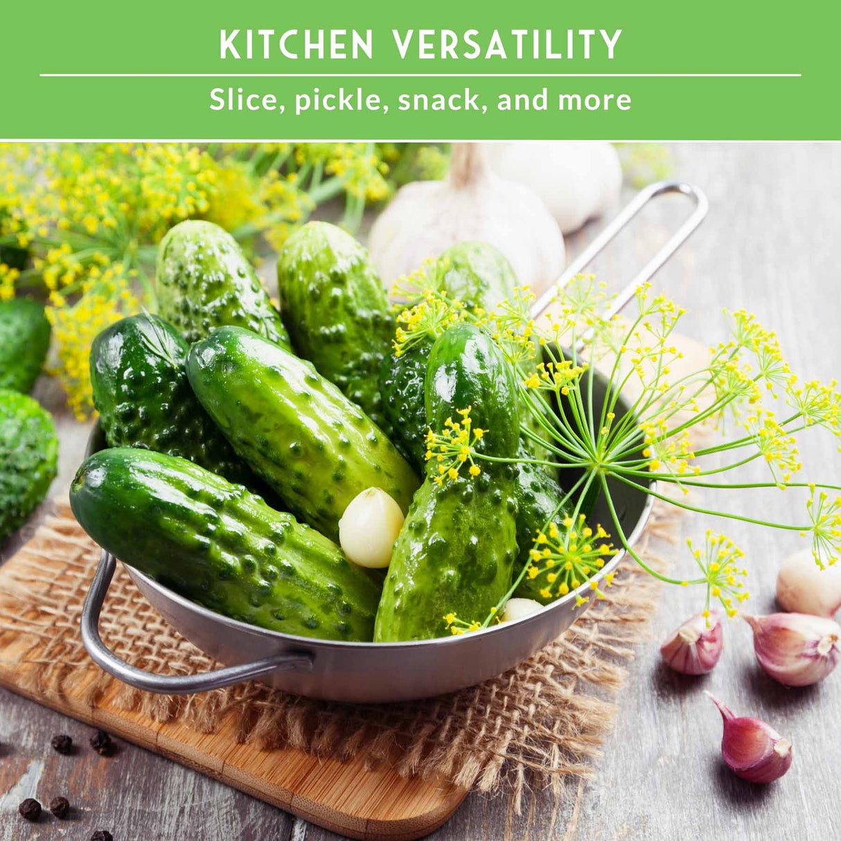 Fresh green cucumbers in a metal bowl with garlic, dill flowers, and a wooden cutting board on a rustic gray surface. A green banner at the top reads 'KITCHEN VERSATILITY' and 'Slice, pickle, snack, and more'.