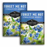 Two packages of Survival Garden Seeds Forget Me Not with blue flowers and green leaves.