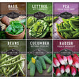 Collection of Survival Garden Seeds packaging for various vegetables with images of basil, lettuce, peas, beans, cucumbers, and radishes.
