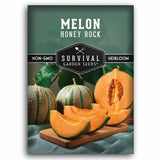 Seed packet for Survival Garden Seeds Honey Rock Melon, featuring a dark green background with white text and a photo of whole and sliced cantaloupe melons on a wooden cutting board.