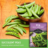 Wooden bowl filled with green peas on a wooden surface, with a package of Survival Garden Seeds pea seeds in the corner.