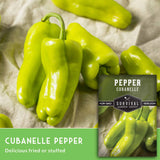 Cubanelle peppers with a label for Survival Garden Seeds on a textured fabric background