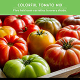 Assorted colorful tomatoes in a wooden box with a green banner above.