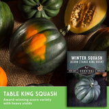 Winter squash with a focus on 'Table King Squash' on a textured surface.