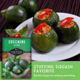 Zucchini round with stuffed pieces on a plate, surrounded by zucchinis and text about Survival Garden Seeds.