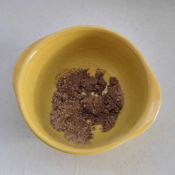 Yellow bowl with moist clean sand